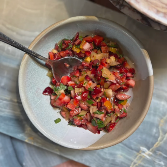 bowl of cut red and yellow fruit salsa