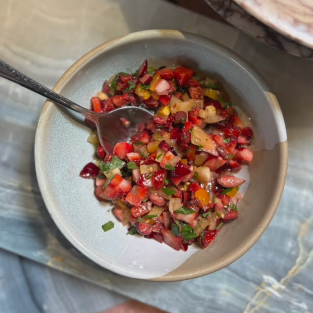 bowl of cut red and yellow fruit salsa
