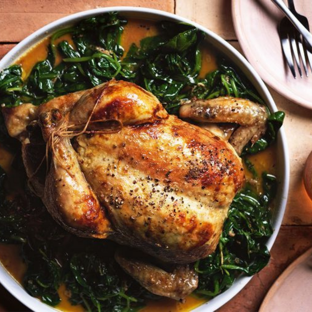Roasted chicken on cooked greens