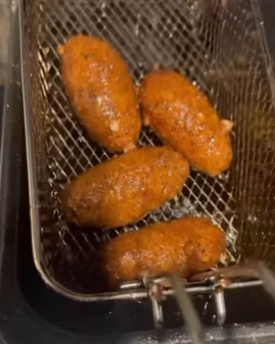 Reuben Croquettes in fryer