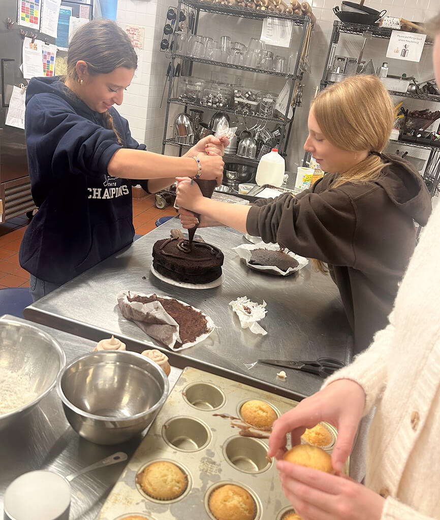 Young culinary students preparing food