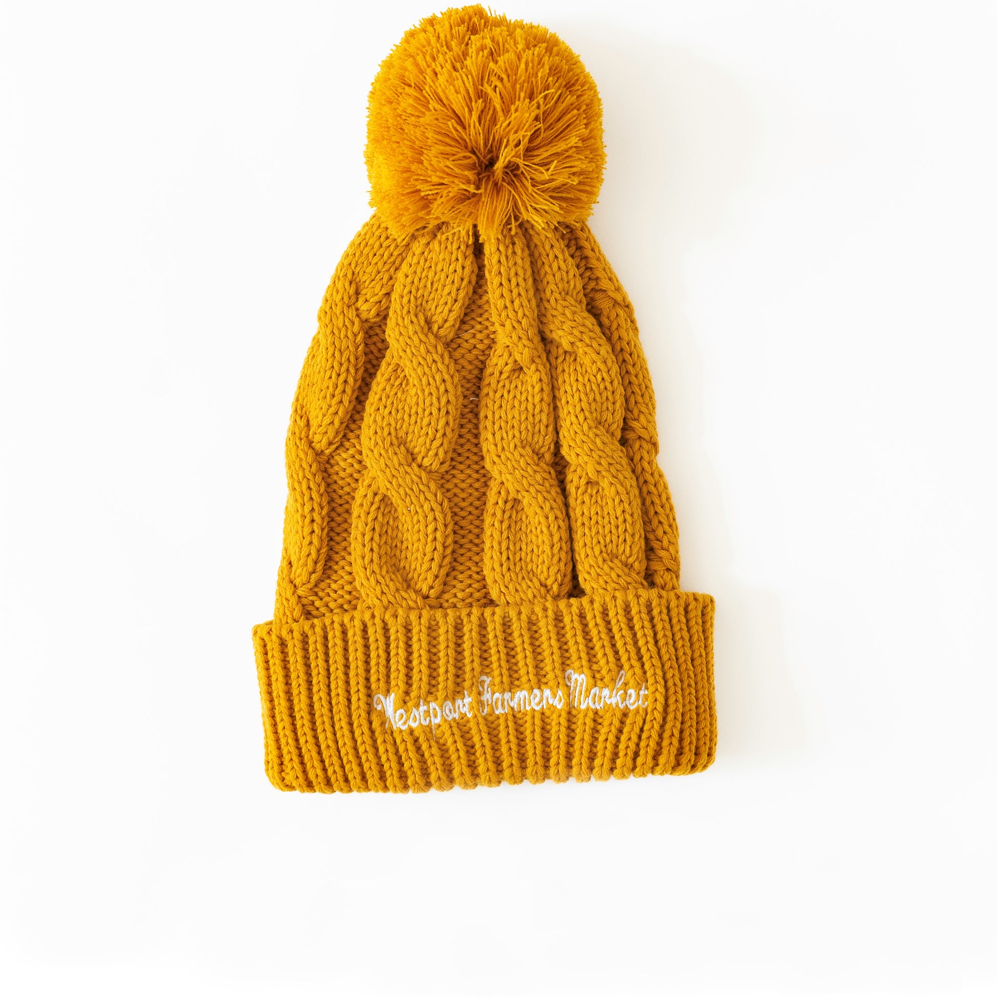 Orange winter hate with pom pom and text on hat that says westport farmers' market