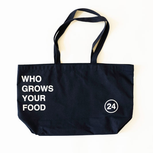 Navy tote bag front with text "who grows your food" and the number 24 in a circle