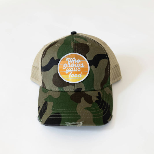 Camo baseball hate with white text on orange circle that says who grows your food